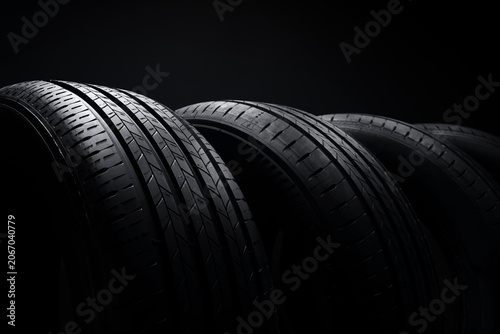 Tableau sur toile Car tires on a dark background