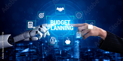Schilderij op canvas Futuristic Collaboration Between Robot Hand and Human Hand for Budget Planning and Financial Strategy in a High-Tech Environment Fluxor