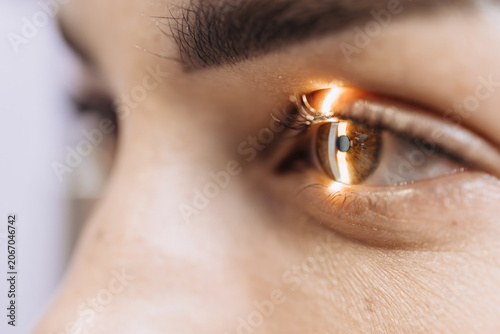 Принти на полотні Close-up of a human eye under examination using a slit lamp for detailed inspect