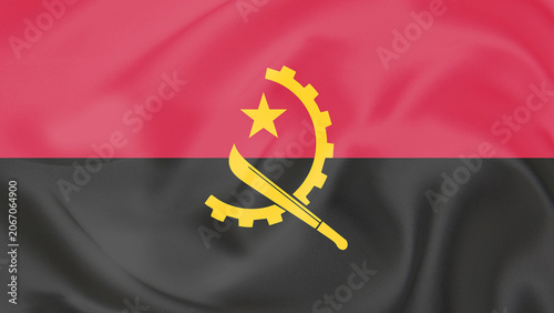 Close-up of Waving National Flag of Angola with Cogwheel and Machete Emblem