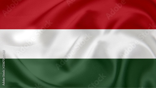 Waving national flag of Hungary with elegant silk fabric texture background