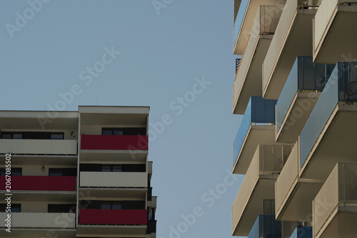 Valokuva Modern apartment buildings with colorful balconies and wide copy space between t