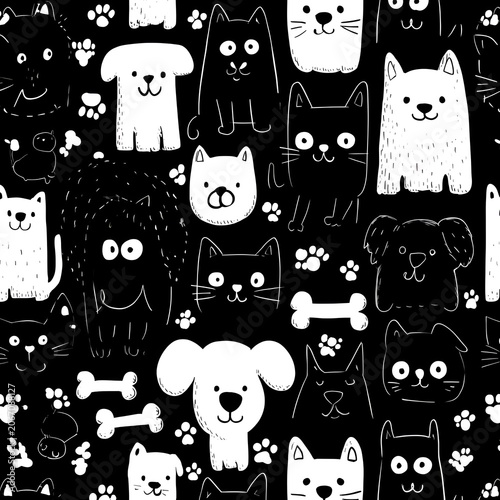 Cute hand-drawn seamless pattern with doodle cats and dogs and paw prints on a black background