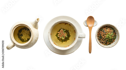 Isolated Japanese genmaicha green tea set with toasted brown rice in ceramic teapot and cup with wooden spoon for tea ceremony