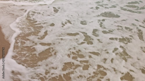 Close-up view of Atlantic Ocean waves washing sandy beach shoreline. Miami Beach. USA.