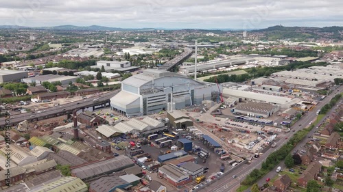 Wide drone aerial view of the Enfinium Kelvin Energy Recovery Facility surrounded by industrial estates, warehouses, residential neighbourhoods and transport infrastructure in Oldbury, West Midlands, 