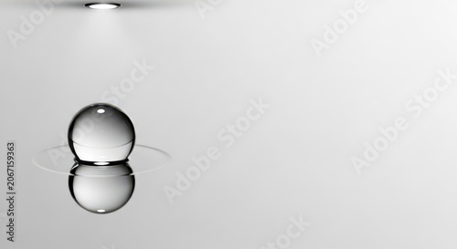 A Single Water Droplet Reflecting Light on a Smooth Surface