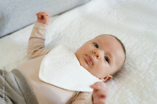 Valokuva Portrait of a two to three month old baby with visible drool on lips