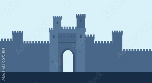 Silhouette view of a massive medieval stone castle with tall towers and a central gatehouse under a clear blue sky.