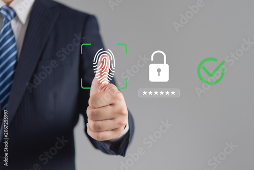 Obraz na plátně Businessman showing thumbs up with glowing fingerprint scan, unlocked padlock, and checkmark
