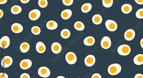 Bold seamless pattern featuring many cross-sections of hard-boiled eggs with bright yellow yolks on a dark navy blue background.