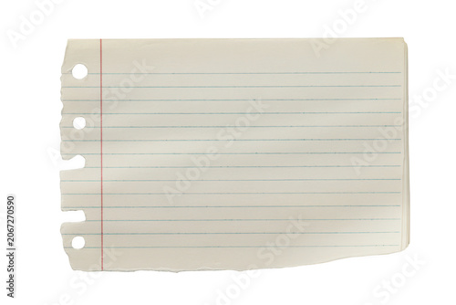 A torn piece of white lined notebook paper with blue horizontal lines and a red vertical margin isolated on a plain black background