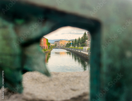 Obraz na plátně Beautiful nostalgic view of historic Otaru Canal and old stone warehouses reflec