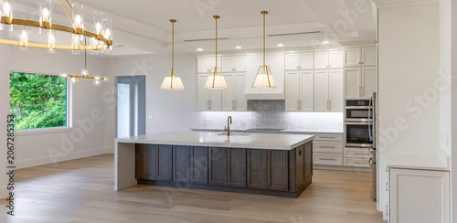 Photos Wide panoramic view of modern luxury kitchen interior with large wooden island s