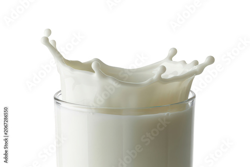 Refreshing splash of white milk in a clear glass creating a crown shape liquid effect isolated on a white background, for advertising
