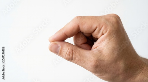 Human Hand Gesture Showing Small Amount Or Holding Invisible Object Isolated On White Studio Background