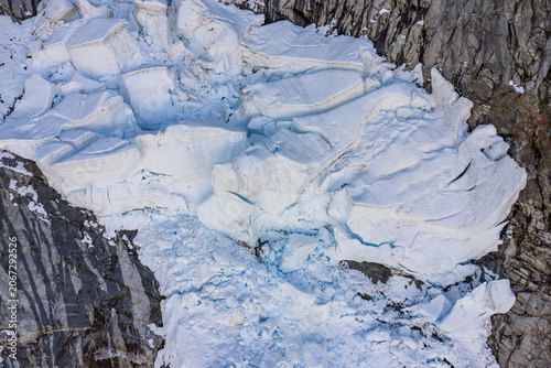 Принти на полотні Aerial View of Glacier Ice Seracs and Crevasses on Rocky Mountain Face in Britis