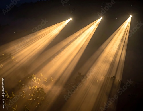 Three beams of light shining upwards.