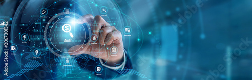 Financial auditor handhold Audit procedures. Corporate officer using spreadsheets verifying transaction records and compliance guidelines on a laptop screen. Secure corporate accounting controls.