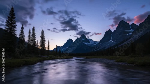 Sunset over rocky mountains and river in pine forest landscape. 4K Video