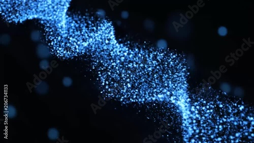 Abstract blue light bokeh particles on dark background.