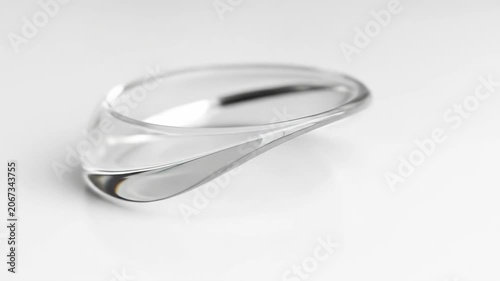 Transparent lens on white surface optical instrument detail