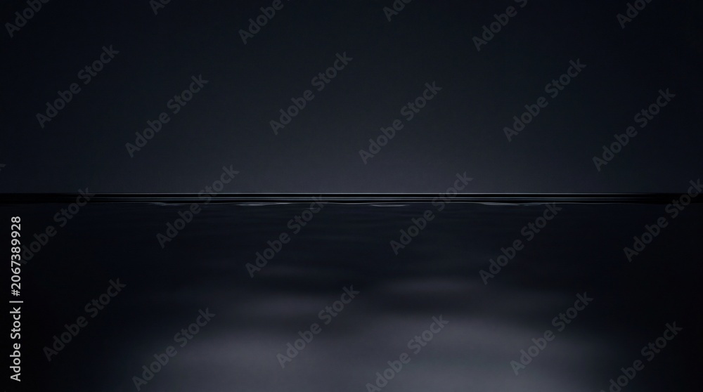Fototapeta premium Calm Dark Water Surface with Subtle Reflections