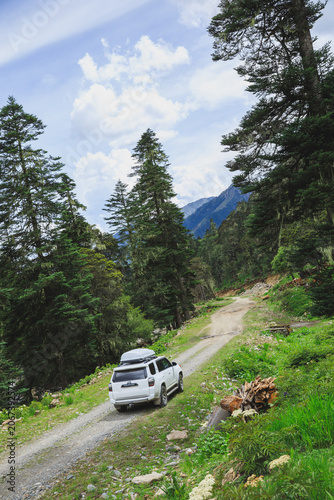 Driving off road car in high altitude mountains in Sichuan, China
