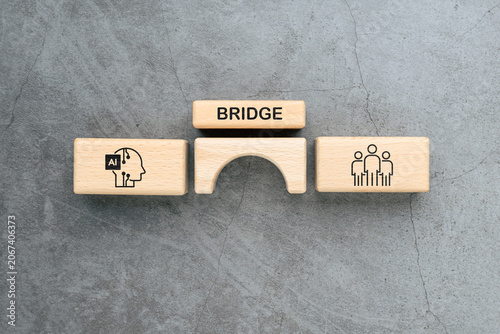 Bridge Between Artificial Intelligence and Humans Concept with Wooden Blocks