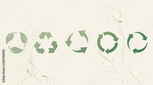 Fotografie Recycling symbols made of green leaves on a beige background with branches