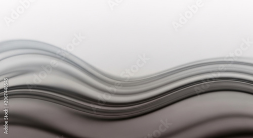 Gray and black wavy lines on a white background with a smooth gradient effect.