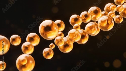Abstract golden liquid spheres floating in a dark cinematic background