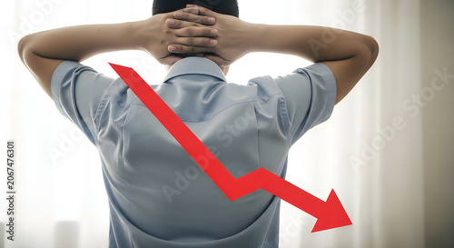 Man with hands on head and red downward arrow on back