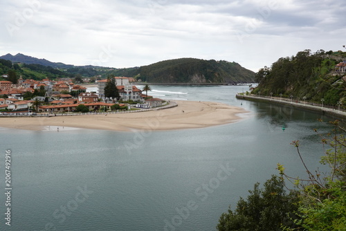 Panoramic view of Ribadesella town and estuary in Asturias, vintage style with empty space for Northern Spain travel design and nostalgic cinematic tourism