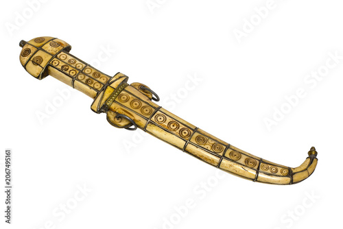 Foto Antique ornate golden dagger in a decorative scabbard isolated