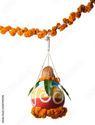 photograph of traditional dahi handi or Matka (earthen pot) tied up high on gokulashtami festival which is Lord Shri Krishna's birth day