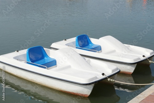 Two Classic Pedal Boats on Calm Water