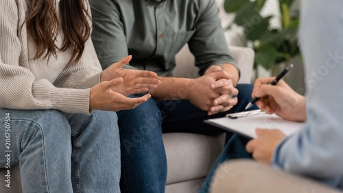 A couple participating in a supportive discussion with a therapist highlighting the significance of emotional connection and communication in a warm environment focused on mental wellness and relation
