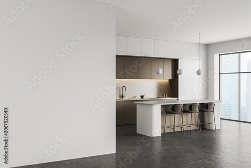 Modern interior kitchen with spacious empty wall for poster mockup in bright minimal design featuring sleek cabinetry, island seating and soft lighting. 3D Rendering