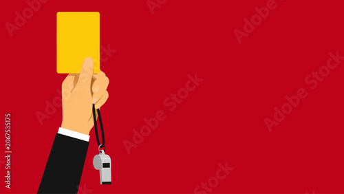 Schilderij op canvas Hand of a Sports Referee Holding a Yellow Card and Whistle Against a Red Backgro
