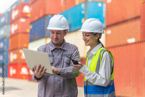Business Team Cargo Container Shipping Inspection. Import and Export Freight at Port.  Manager and Foreman Teamwork Inspecting Containers Shipment with success and happiness. 