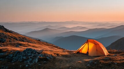 Gardinen Fotos Bright orange camping tent sitting on a high grassy mountain ridge during a beautiful soft golden hour sunset landscape scene  © Harry