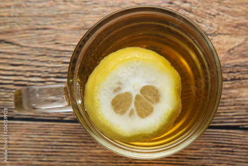 Green tea in a mug with lemon