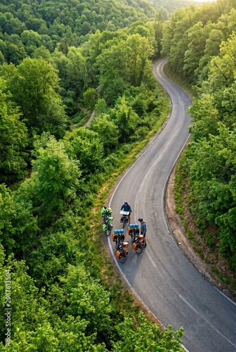 Generated AI Cyclists navigate a winding asphalt road through a lush green forest landscape