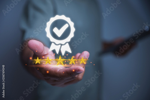 Person Holding Quality Guarantee Ribbon Badge with Glowing Five-Star Rating.