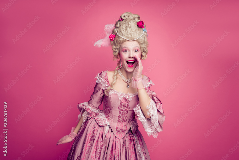 Naklejka premium Photo of excited lady in antique style costume hand shouting announcing isolated pink color background