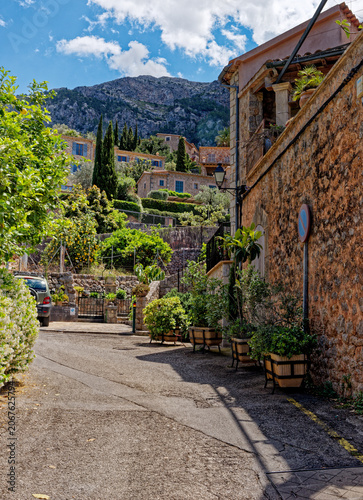 Old street in historic town of Deia in the mountains of Mallorca, Spain