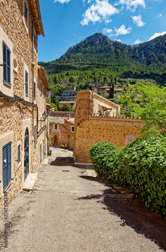 Old street in historic town of Deia in the mountains of Mallorca, Spain