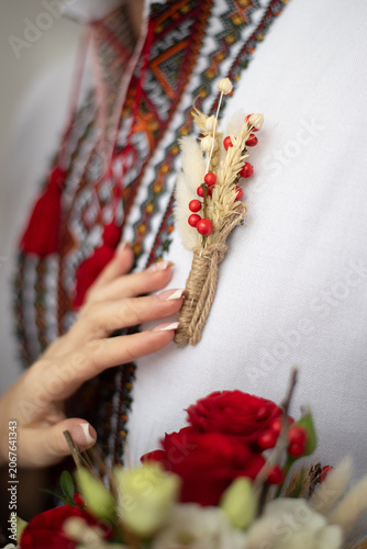 bride and groom in embroidered Ukrainian dresses. A beautiful bouquet