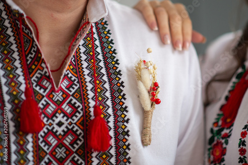 bride and groom in embroidered Ukrainian dresses. A beautiful bouquet